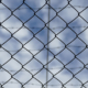 A closeup photo of a chain link fence.